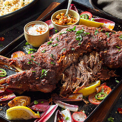 Slow roasted lamb shoulder topped with a spice crust served with fluffy basmati rice from Dawat Foods.